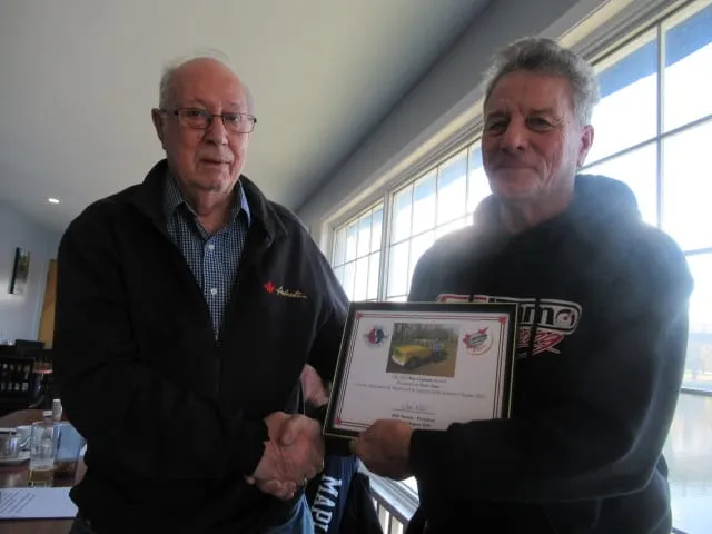 Peter Sant (left) being presented the 2024 Roy Graham Award by Ian Graham